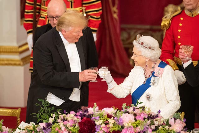 Donald Trump and the late Queen Elizabeth II make a toast during the state banquet at Buckingham Palace in June 2019 (Dominic Lipinski/PA)