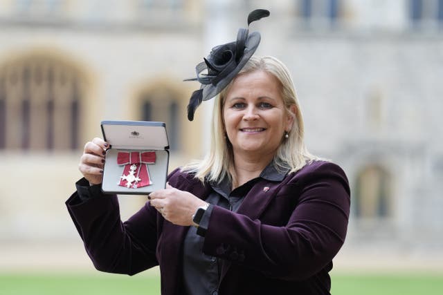 Kay Cossington with her accolade (Andrew Matthews/PA)