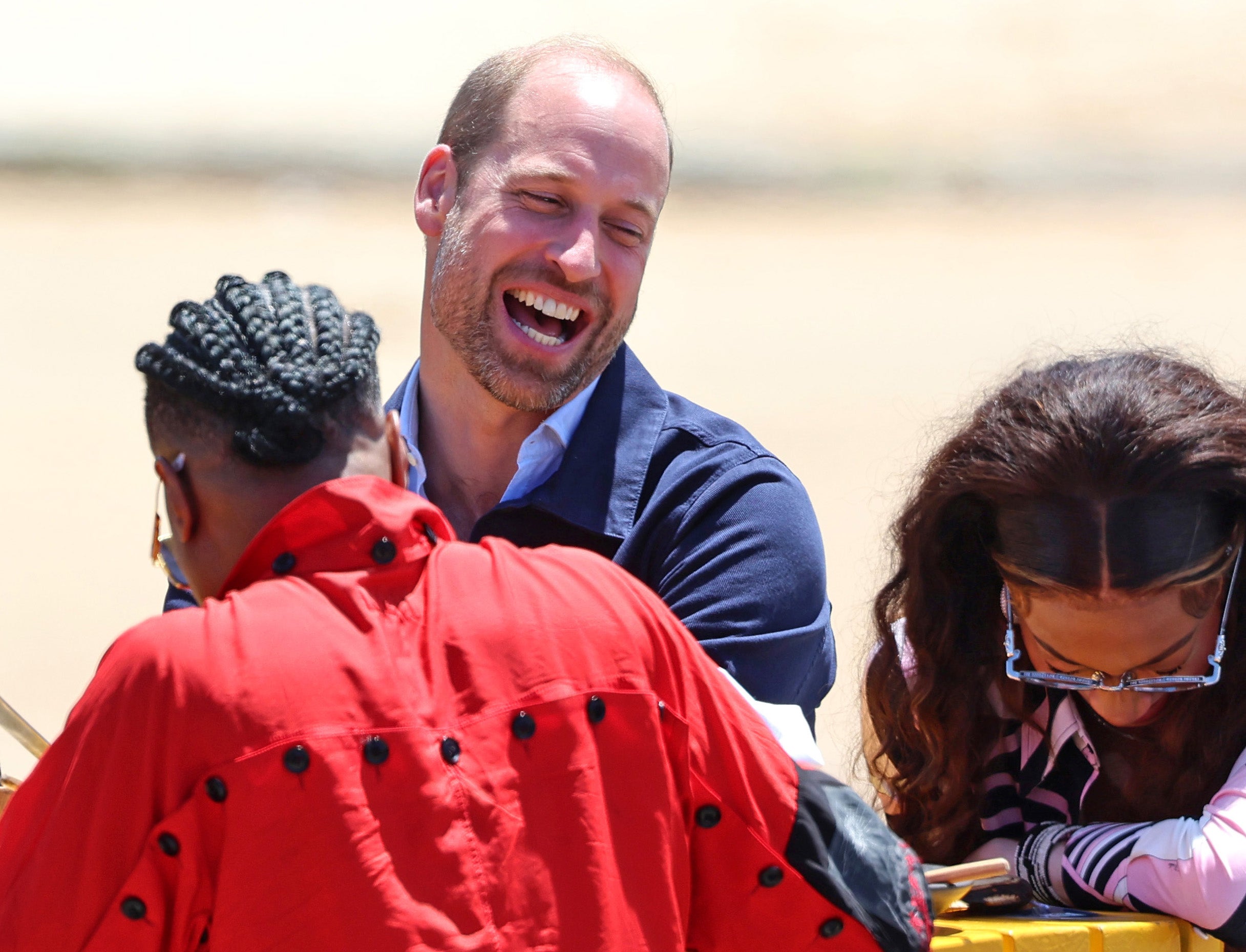 Prince William, Prince of Wales and Winnie Harlow join members of the local community for a traditional fish braai lunch during a visit to Kalk Bay Harbour