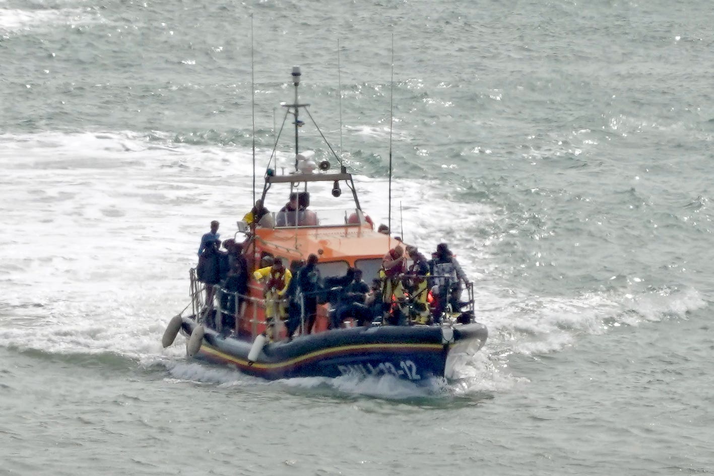 A group of people thought to be migrants are brought in to Dover (Gareth Fuller/PA)