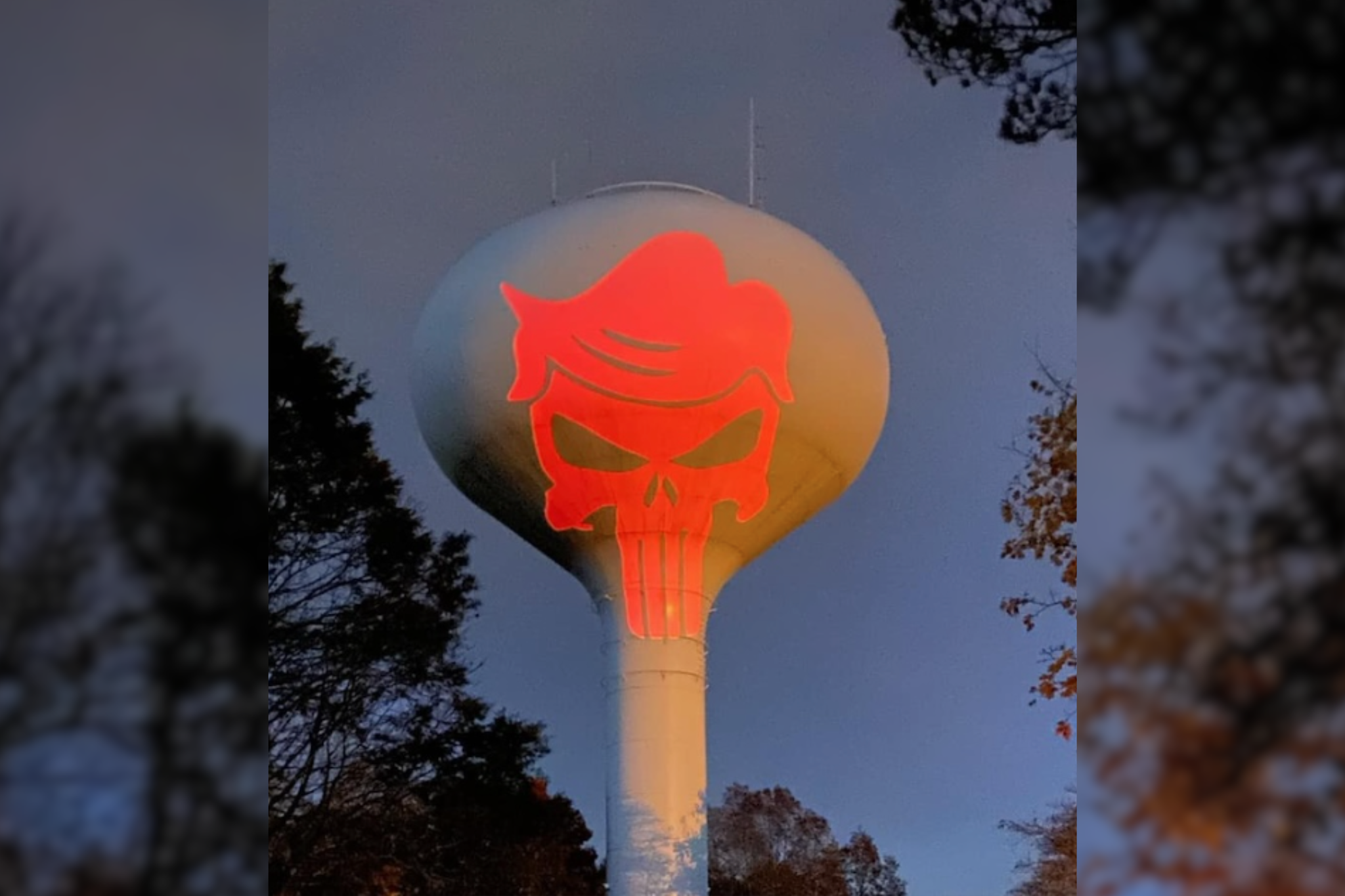 Projection of ‘The Punisher’ logo with Donald Trump’s hair on Massachusetts water tower