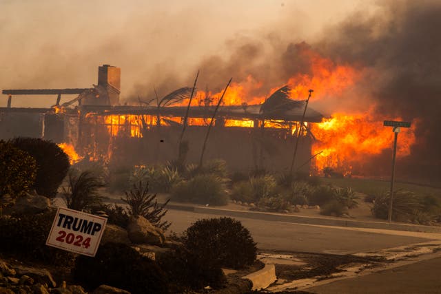 <p>A home burns in the Mountain Fire near Camarillo, California. The fire started Wednesday amid extreme conditions fueled by the Santa Ana winds. </p>