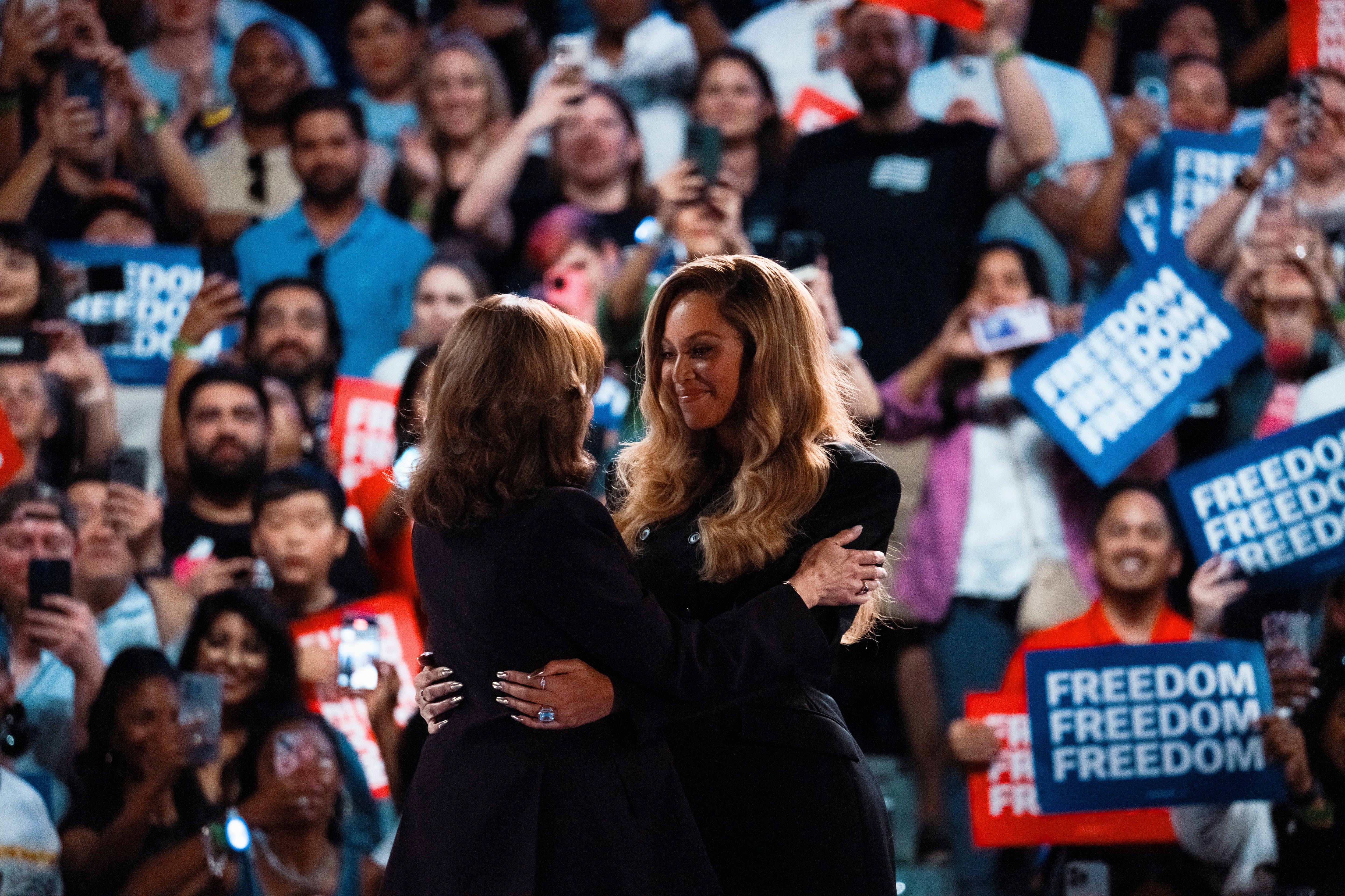 Kamala Harris embraces Beyonce at a campaign rally on October 25, 2024 in Houston, Texas