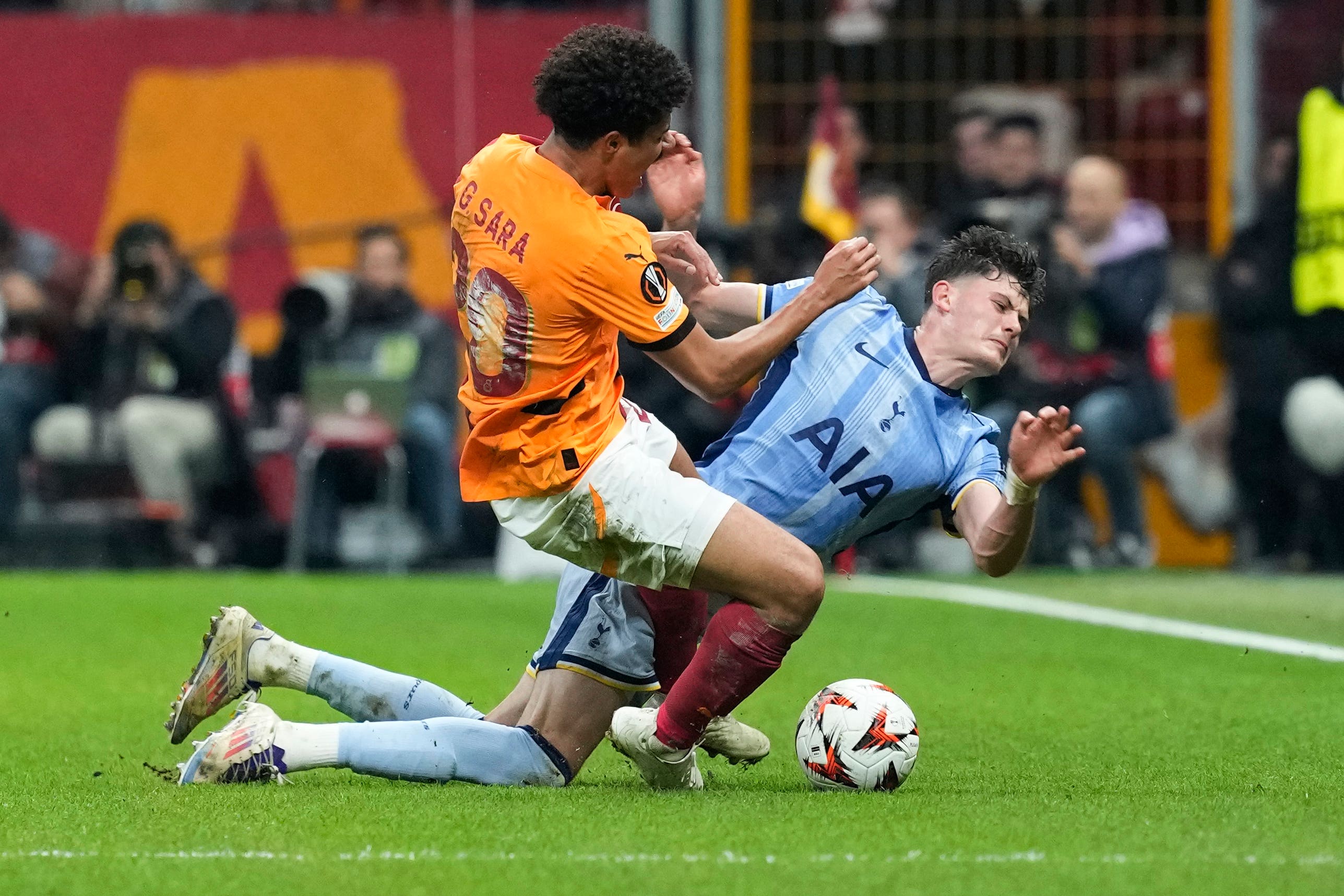 Tottenham’s Will Lankshear, right, challenges for the ball (Khalil Hamra/AP)