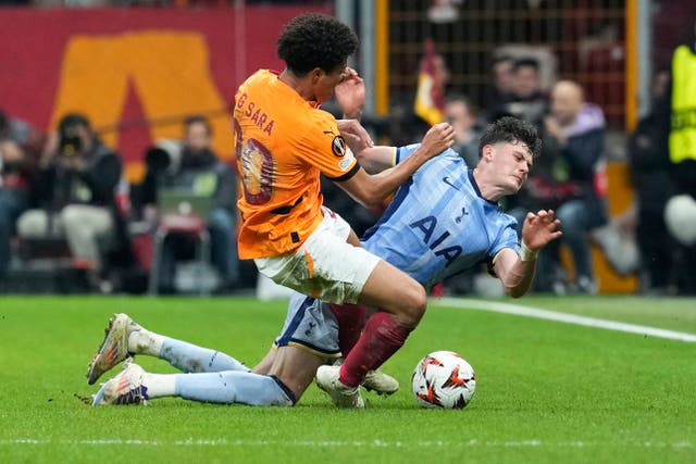 Tottenham’s Will Lankshear, right, challenges for the ball (Khalil Hamra/AP)