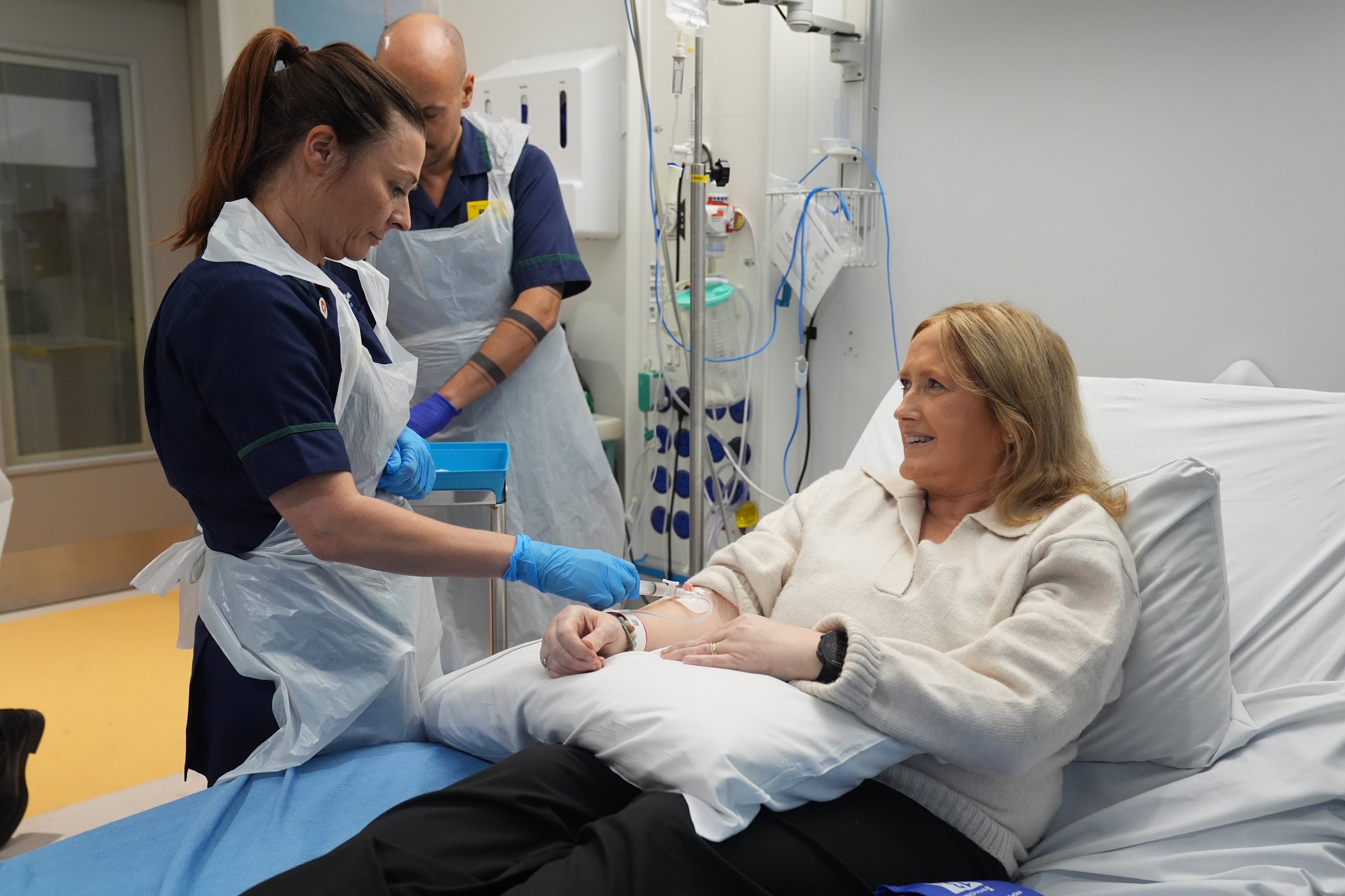 Senior Clinical Practice Facilitator Nicole Prescott administering breakthrough treatment to patient Katie Tinkler for lupus