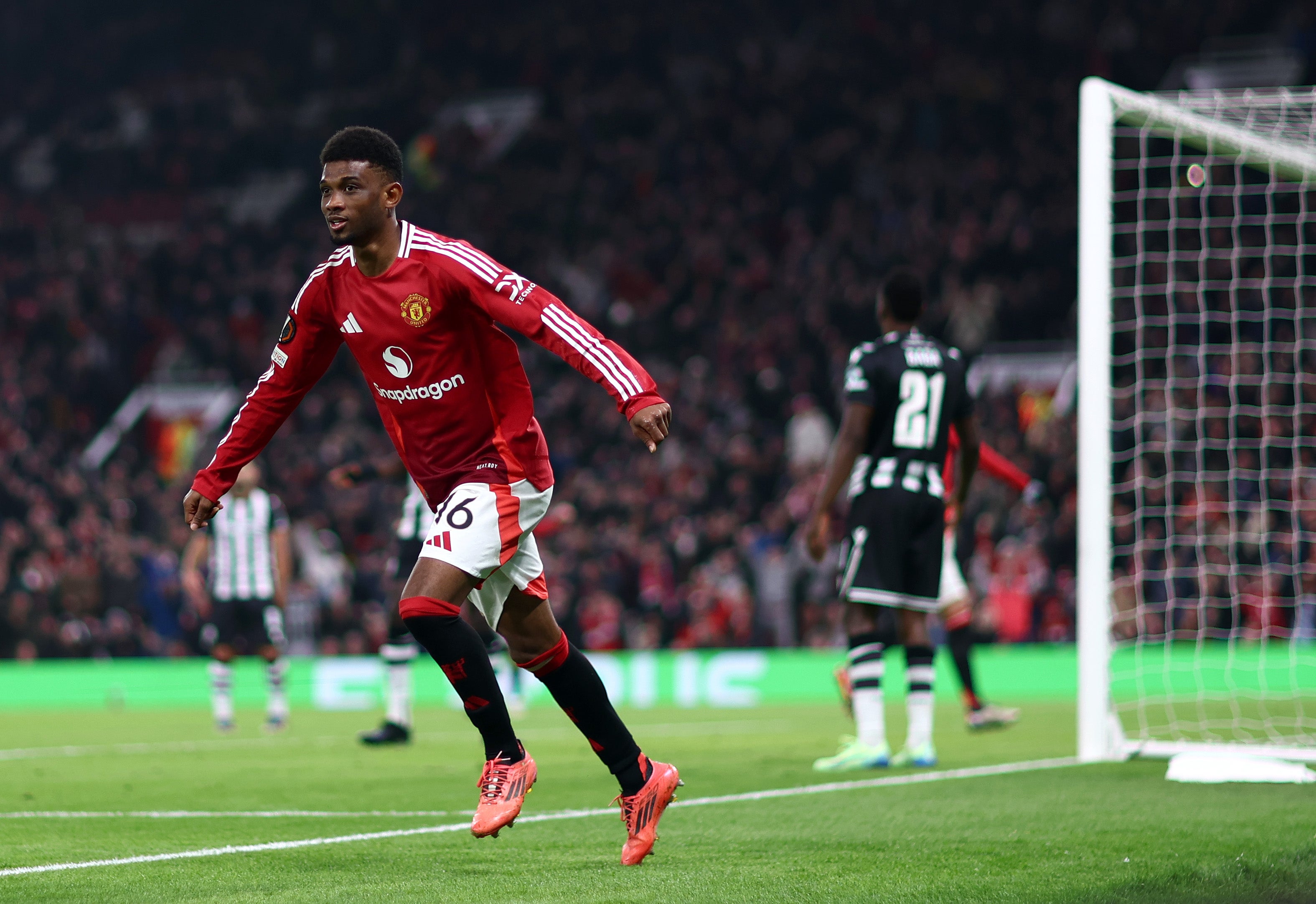 Amad Diallo celebrates after scoring a header