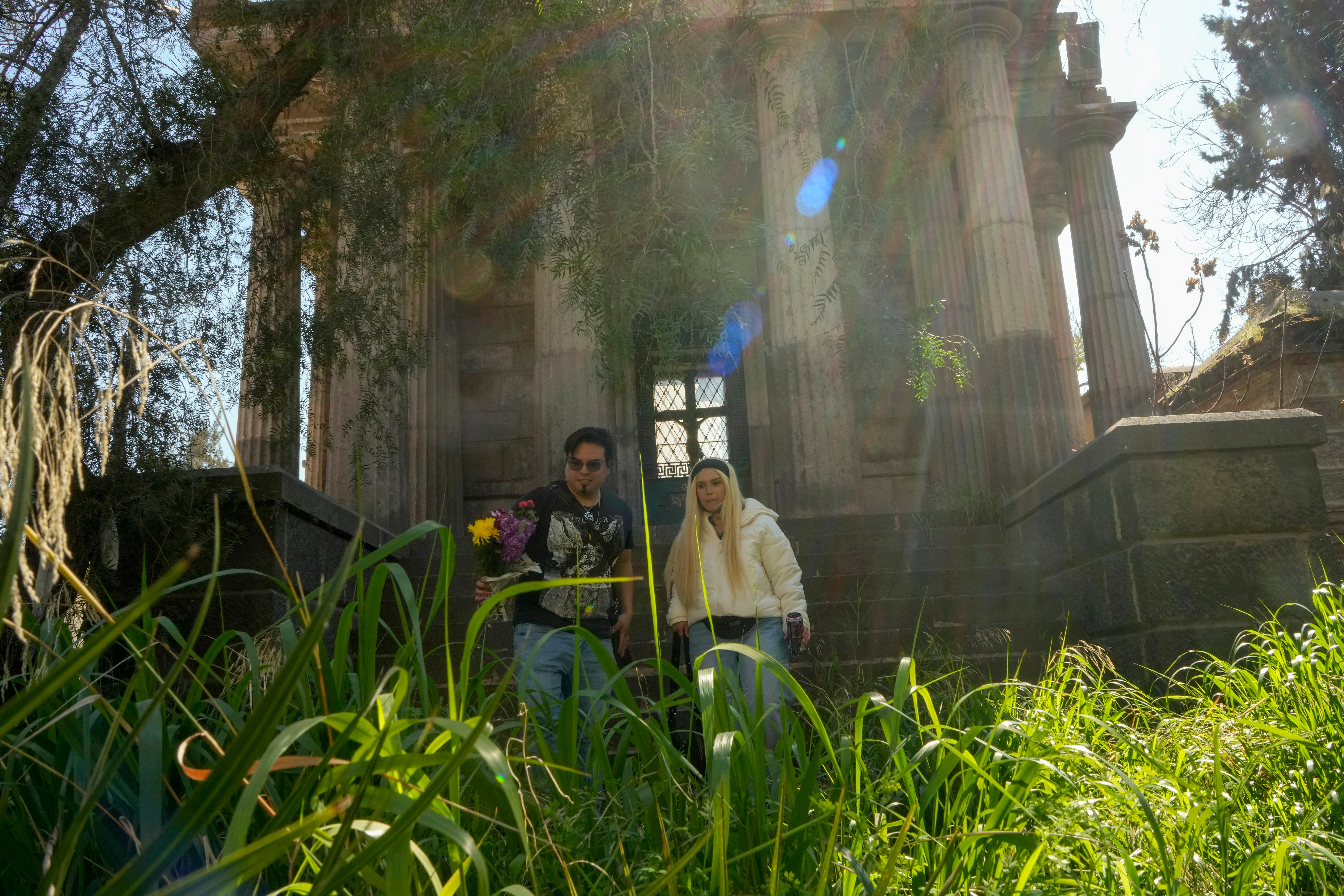 Members of The Temple of Satan: Satanists and Luciferians of Chile walk through the General Cemetery