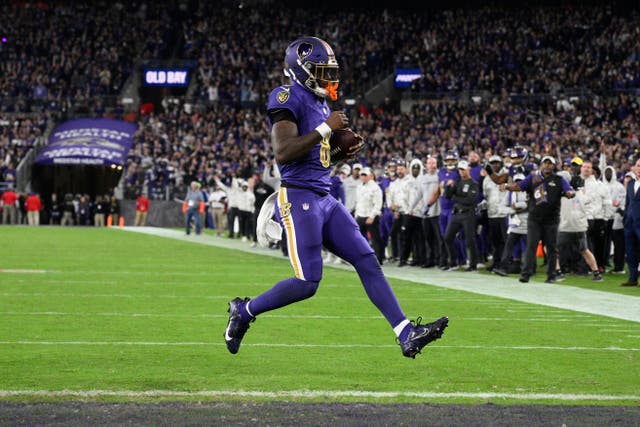 Baltimore Ravens quarterback Lamar Jackson scores a two-point conversion during the second half of an NFL football game against the Cincinnati Bengals (Nick Wass/AP)