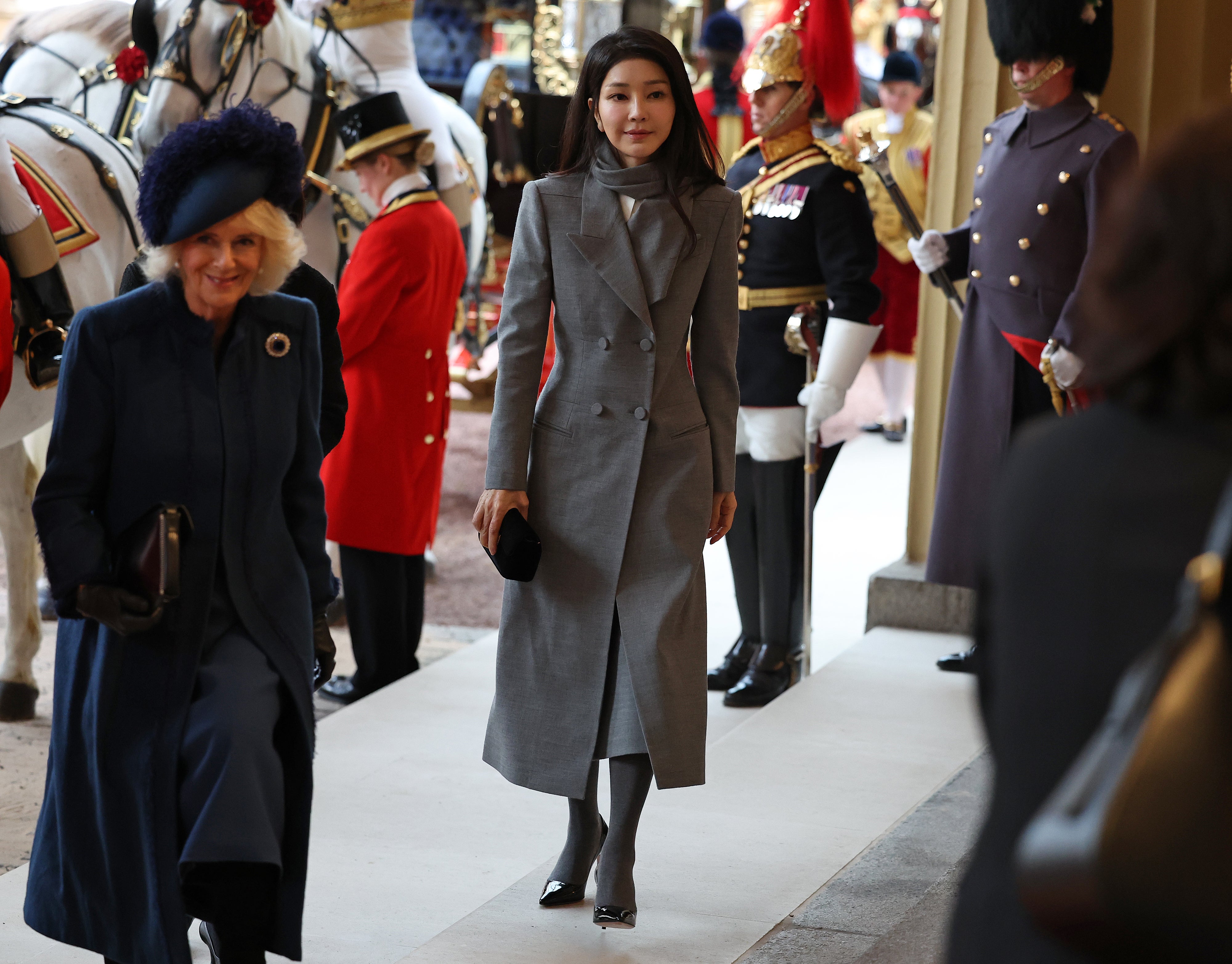 South Korea’s First Lady Kim Keon-hee (C) and Britain’s Queen Camilla (L) arrive at Buckingham Palace following a ceremonial welcome for The President and the First Lady of the Republic of Korea at Horse Guards Parade on 21 November 2023 in London, England