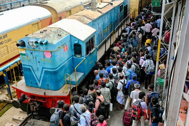 <p>File: Passengers bound for their hometowns wait to board a train ahead of Diwali, the Hindu festival of lights, at a railway station in Chennai on 29 October 2024</p>