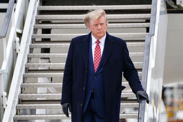 Donald Trump arrives in his private jet at Aberdeen International Airport (PA)