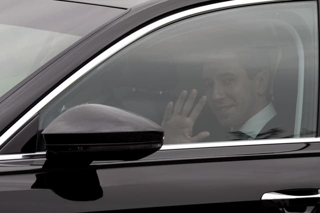 Taoiseach Simon Harris waves as he arrives at Aras an Uachtarain (Brian Lawless/PA)