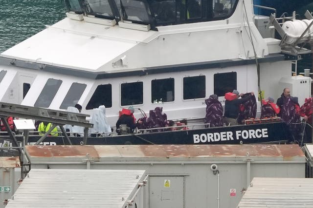 A group of people thought to be migrants, including young children, are brought in to Dover, Kent, from a Border Force vessel (Gareth Fuller/PA)