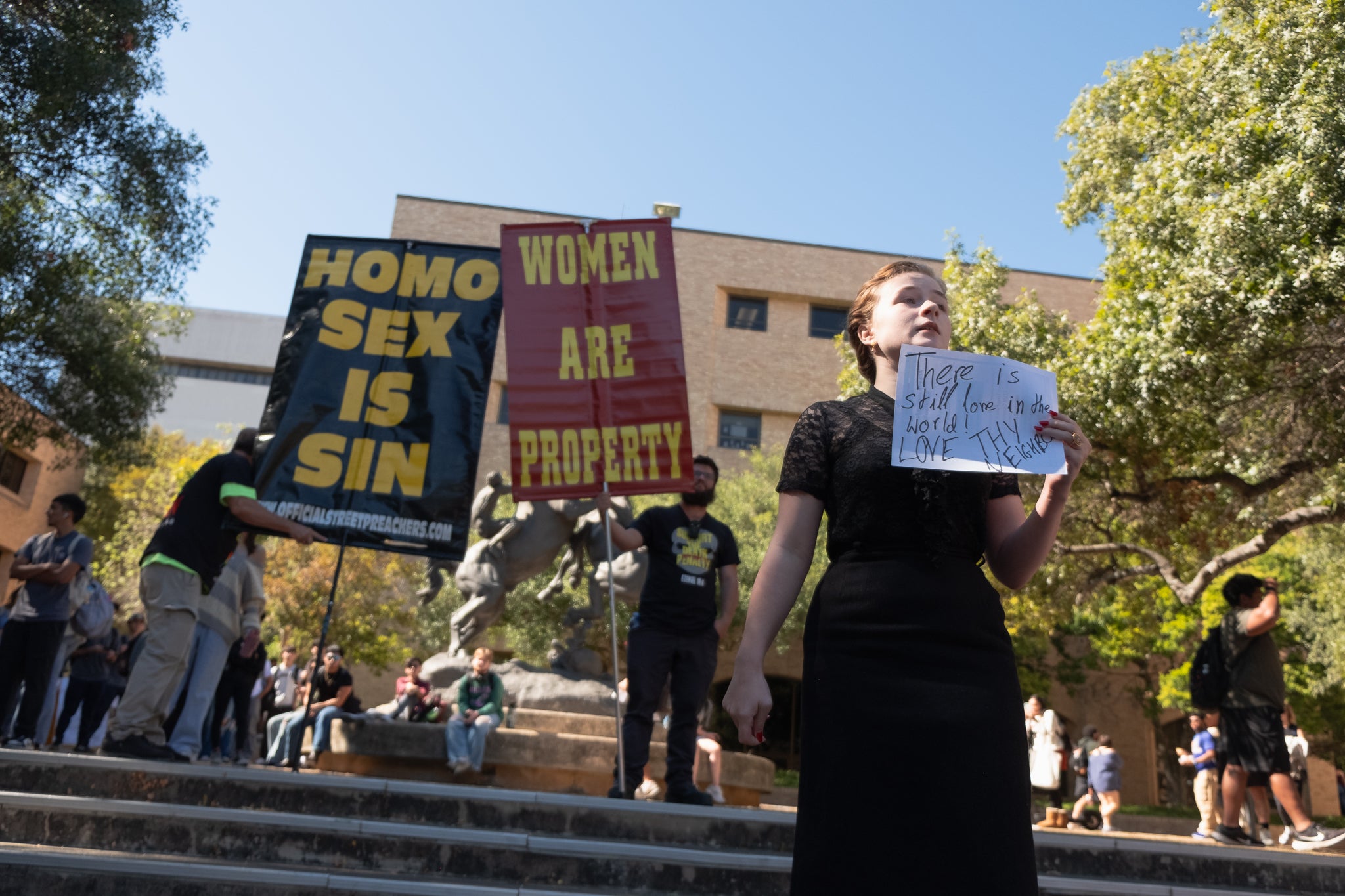 Eva De Arment, a 19-year-old sophomore, at Texas State University at San Marcos counterprotests in front of members of the Official Street Preachers