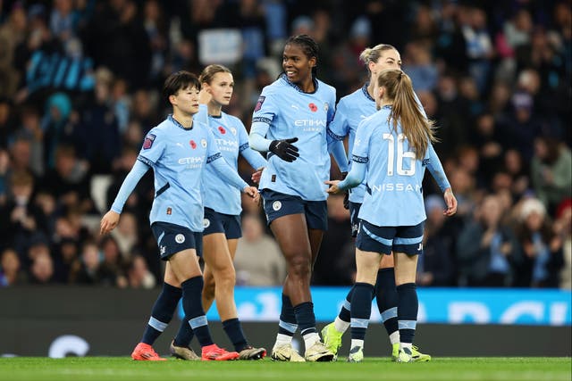 <p>Khadija Shaw (centre) scored a hat-trick at the Etihad Stadium</p>