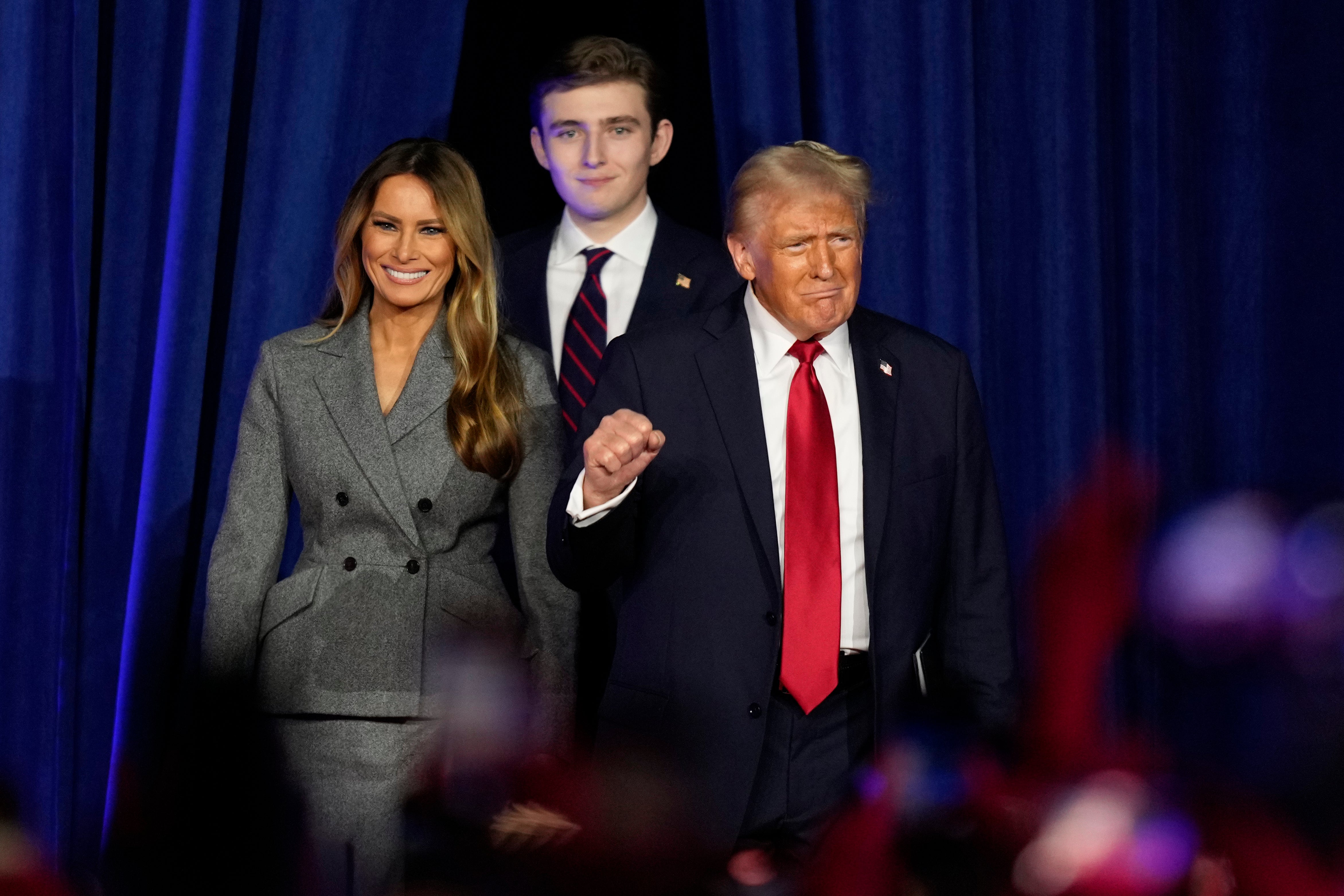 Barron Trump pictured with his parents Melania and Donald Trump during an election night party