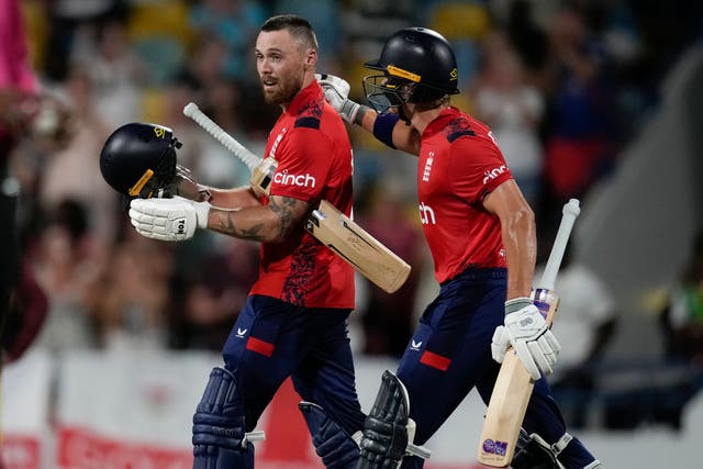 England’s Jacob Bethell, right, congratulates Phil Salt for scoring a century against West Indies during the first T20 cricket match in Barbados on Saturday (Ricardo Mazalan/AP)