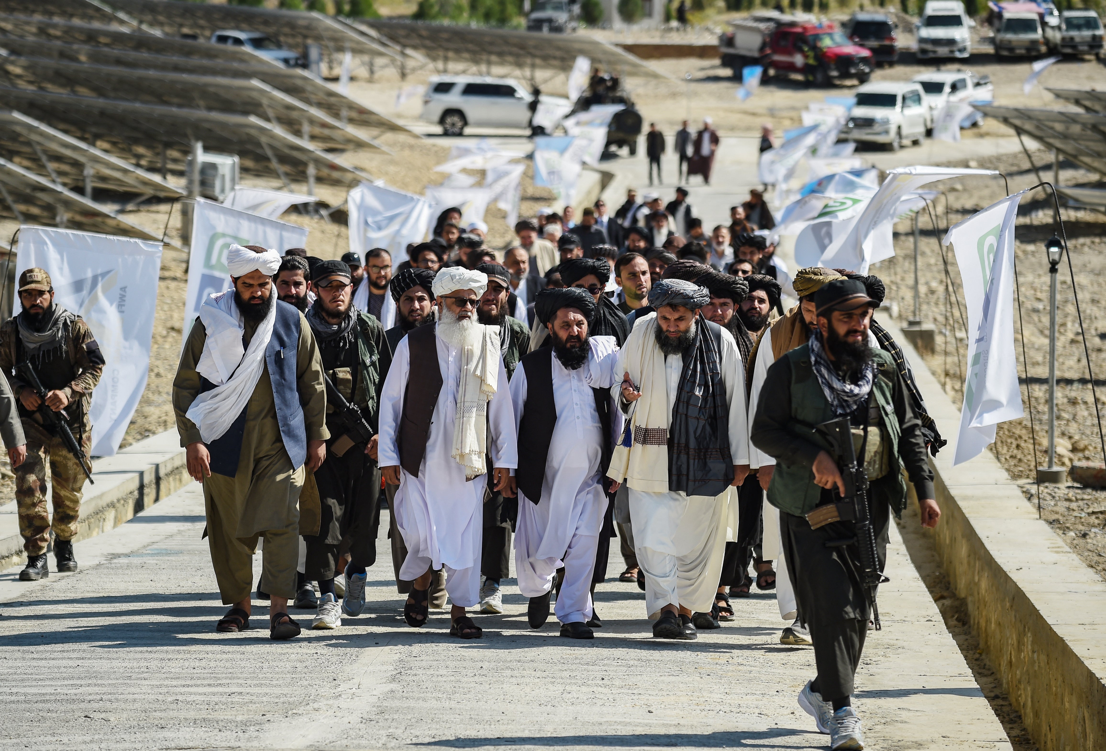 Taliban authorities arrive for the inauguration of a ten megawatt solar energy project in Naghlu in Surobi district of Kabul province