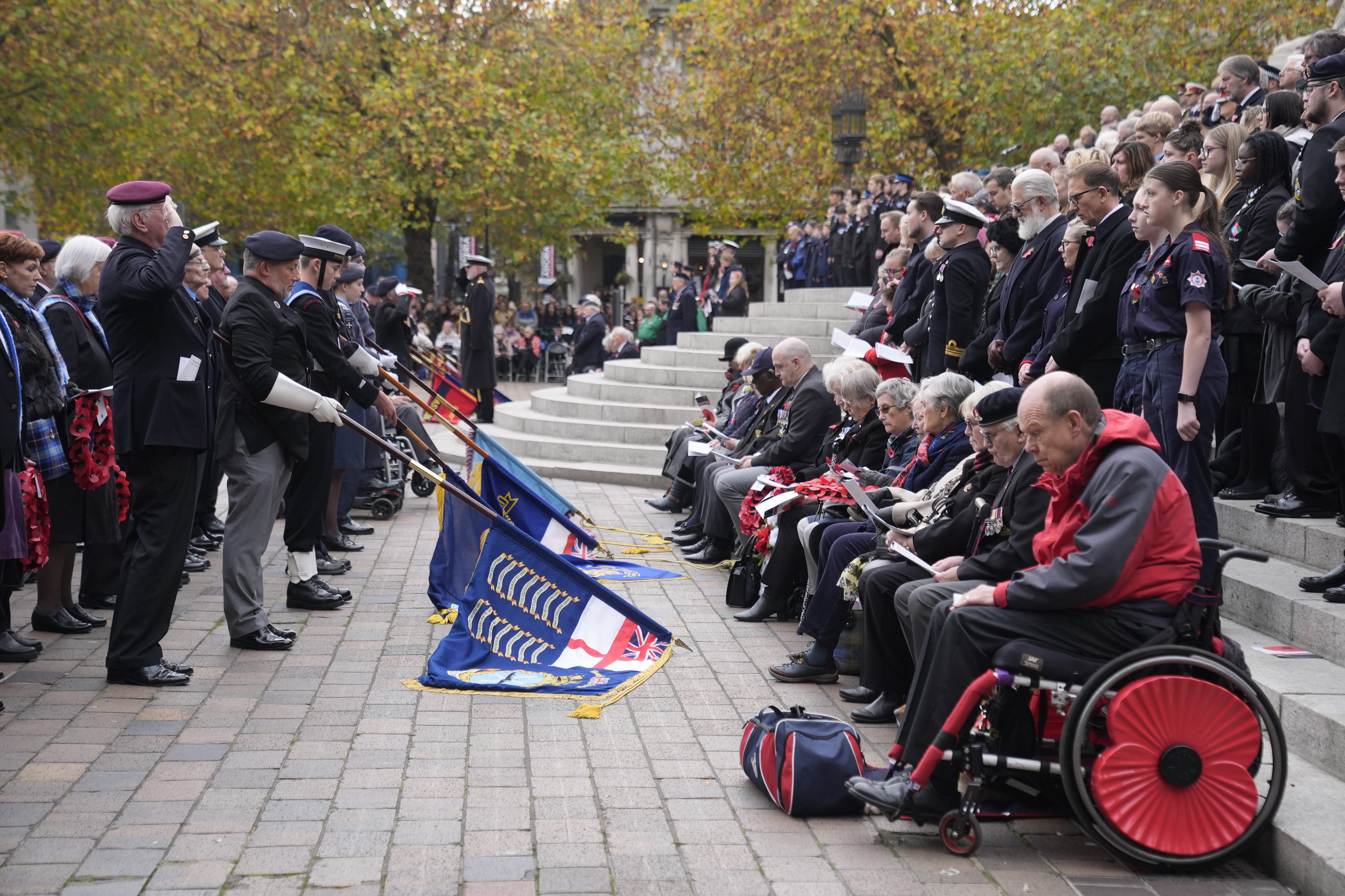 Those gathered observed a minute’s silence during a service in Guildhall Square (Andrew Matthews/PA)