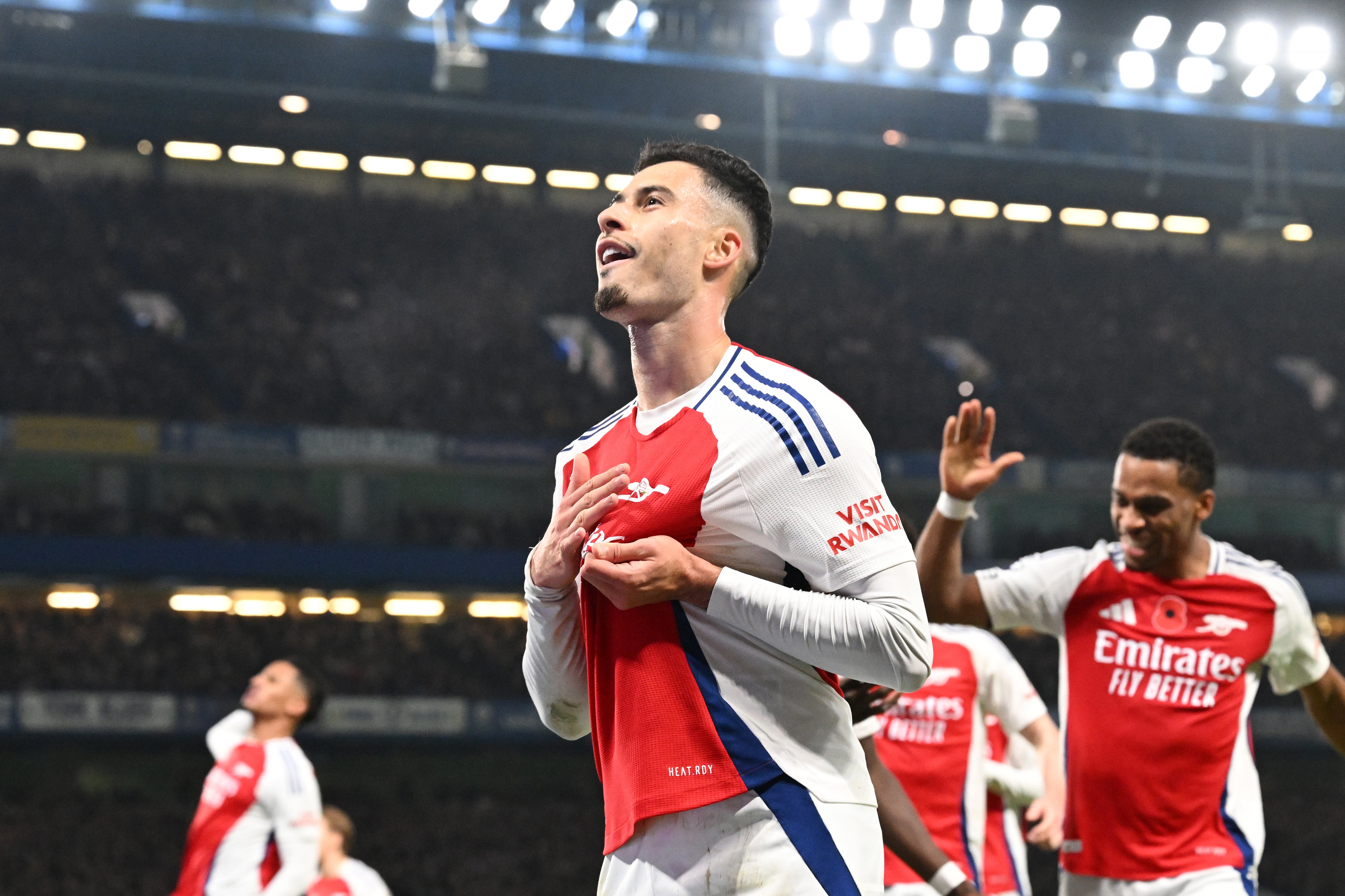 Martinelli celebrates with the away supporters