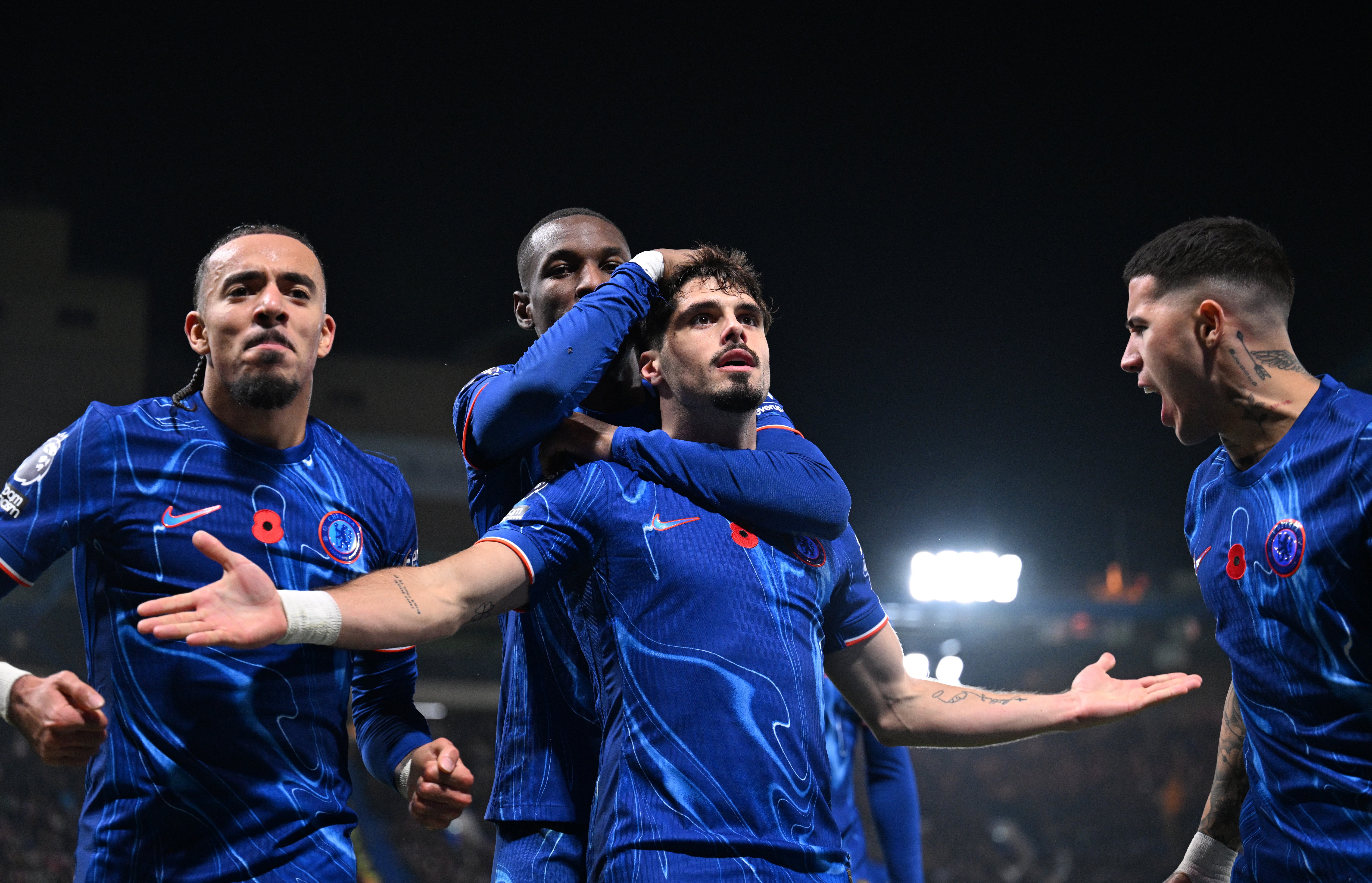 Pedro Neto celebrates in front of the Chelsea fans