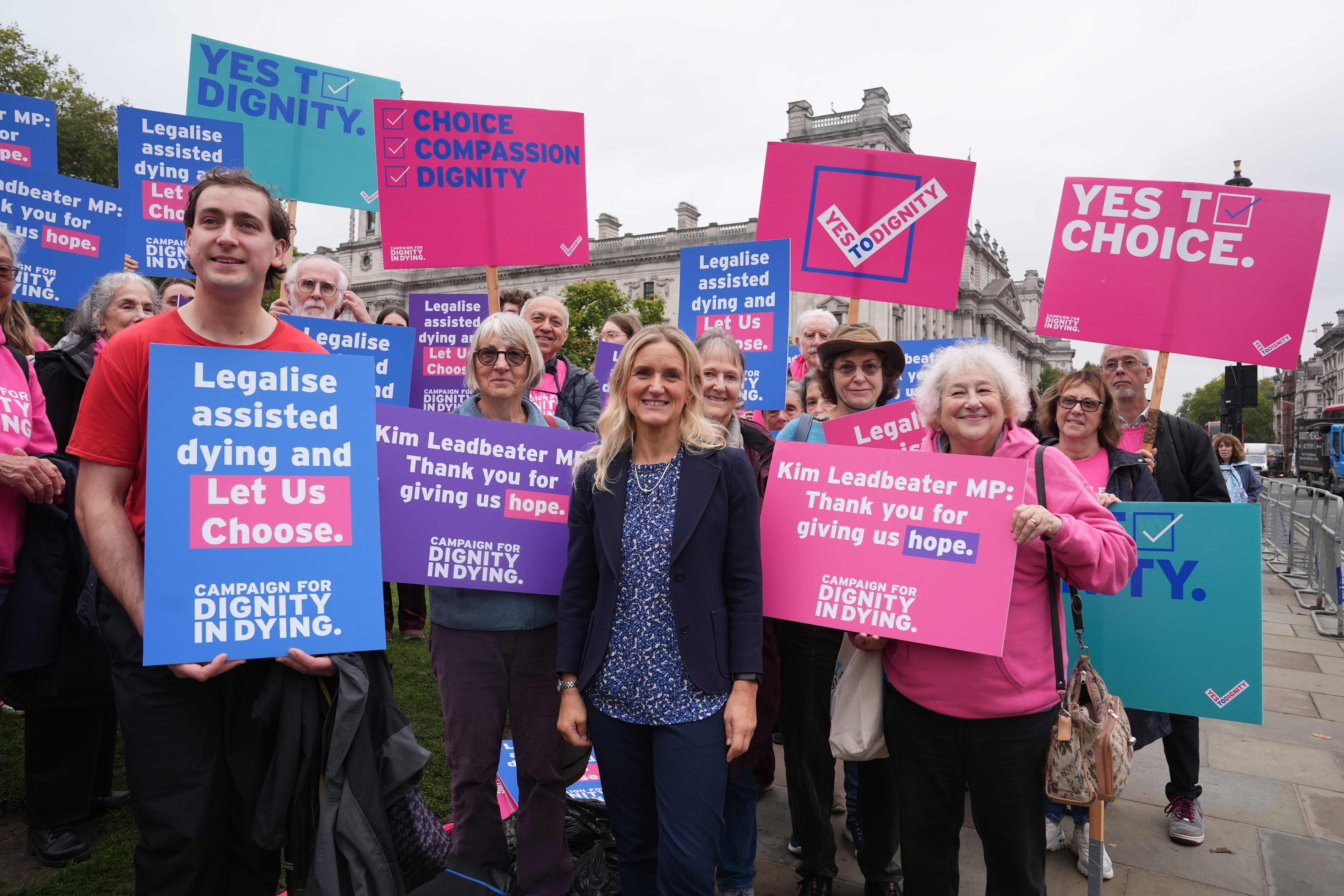 Labour MP Kim Leadbeater (centre) joins Dignity in Dying campaigners in Parliament Square, outside the Houses of Parliament (Lucy North/PA)