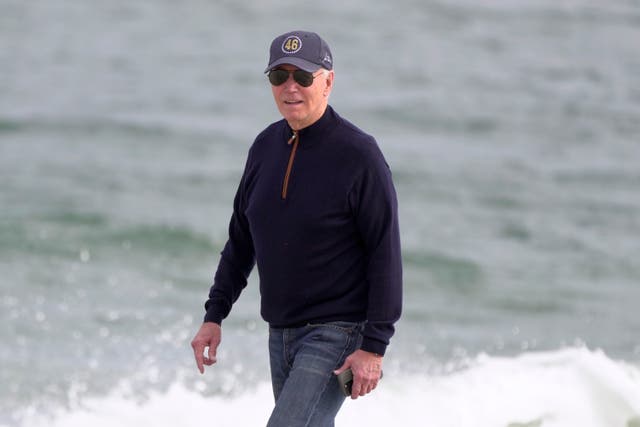 <p>President Joe Biden walks on the beach in Delaware on Sunday. The Sierra Club is urging the president to go ‘out with a bang’ before leaving the White House, and others are calling on the administration to fortify climate policy</p>