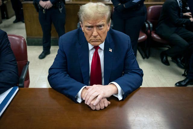 <p>Donald Trump, pictured sitting in New York Justice Juan Merchan’s courtroom in Manhattan in April, will face another delay on whether the verdict in his hush money case can be tossed out </p>