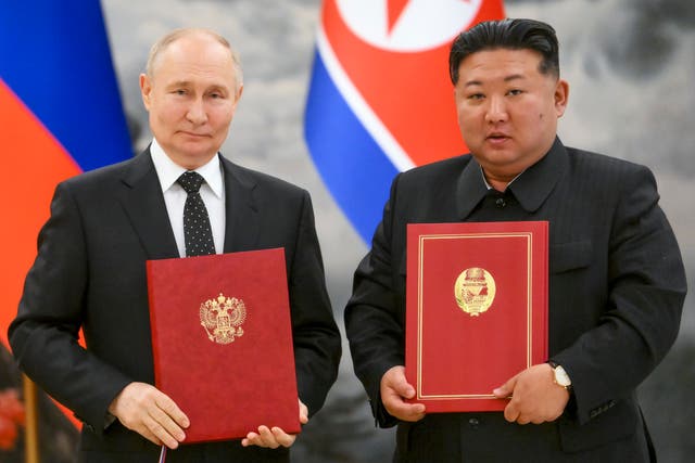 <p>Vladimir Putin and  Kim Jong Un signed a deal to ‘immediately provide military and other assistance using all available means’ if either side is in a state of war </p>