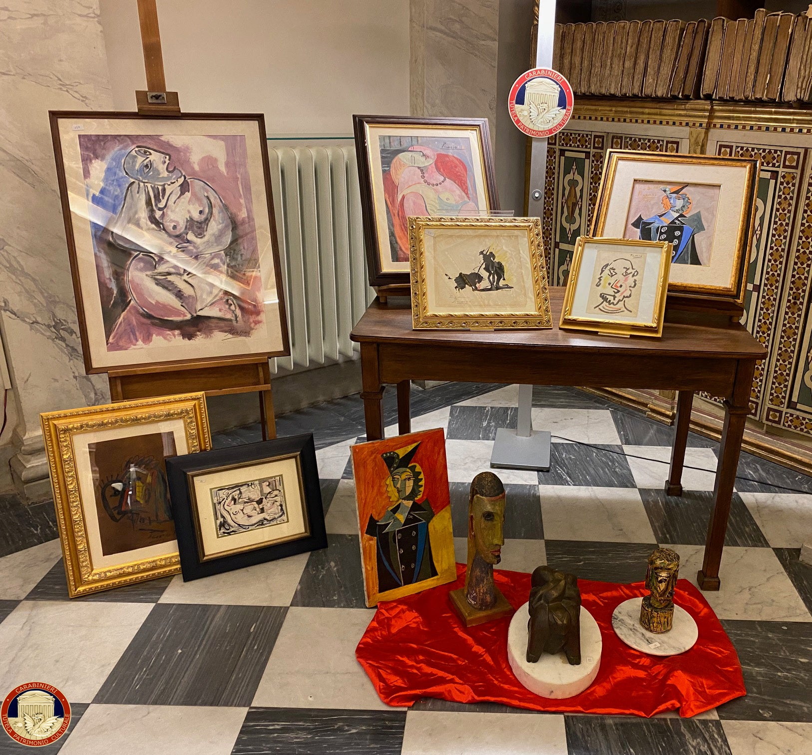 Modern and contemporary fake artworks, including Banksy, Pablo Picasso and Andy Warhol, are displayed after Italian police uncover crime ring