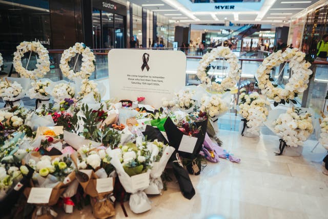 <p>Flowers and gifts are laid at the Westfield Bondi Junction shopping centre</p>