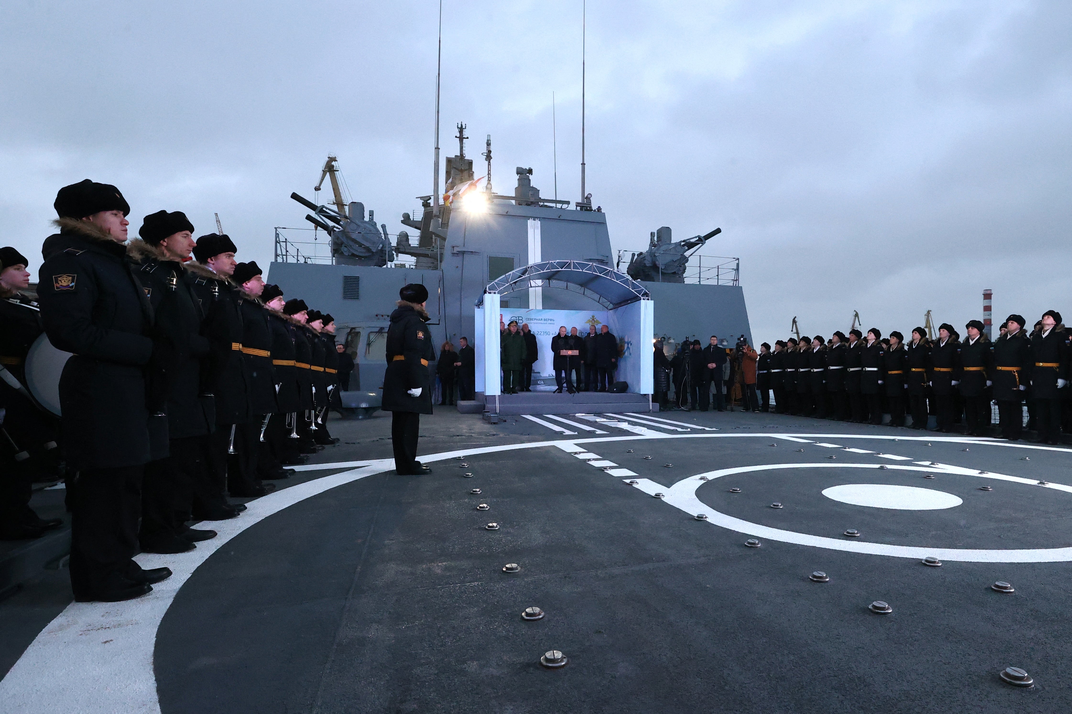 Vladimir Putin attends a flag-raising ceremony on the Admiral Golovko warship in St Petersburg, on 25 December 2023