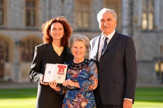 Dame Imelda Staunton (centre) with her husband Jim Carter and daughter Bessie Carter after being made a Dame Commander of the British Empire