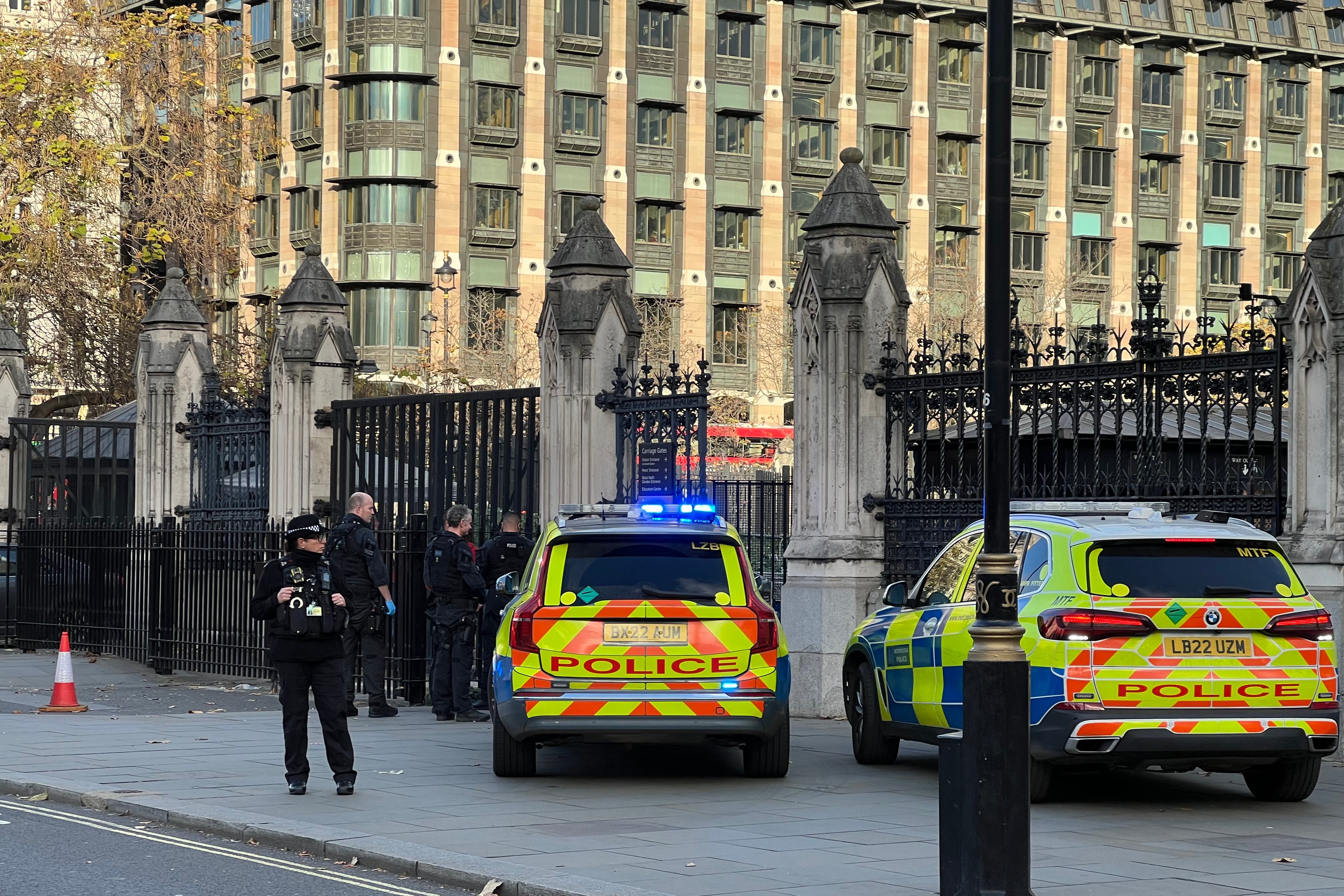 Police cars were seen outside Carriage Gates following reports of a man carrying knives near Parliament (PA)