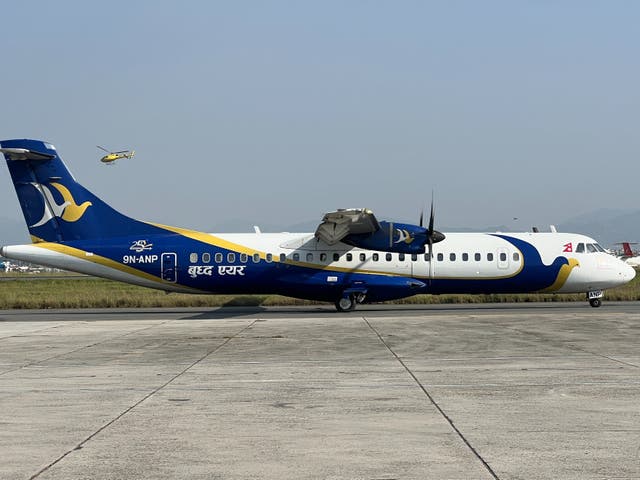 <p>Flight path to enlightenment: Buddha Air plane at Kathmandu airport</p>