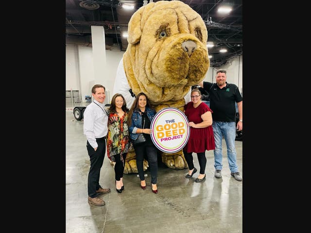 <p>Members of The Good Deed Project, a Las Vegas based non-profit that helps individuals in need, stands with Mr Deeds, a 700-pound stuffed dog that serves as the group’s mascot. The dog was stolen in November and has since been recovered by police, but the dog suffered damage and is still in police possession</p>