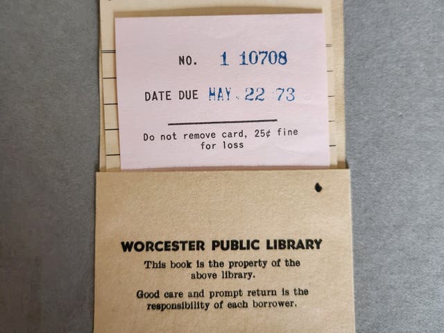 <p>The return card inside a copy of ‘The Early Work of Aubrey Beardsley’, which has found its way back to the Worcester Public Library 51 years after it was due</p>