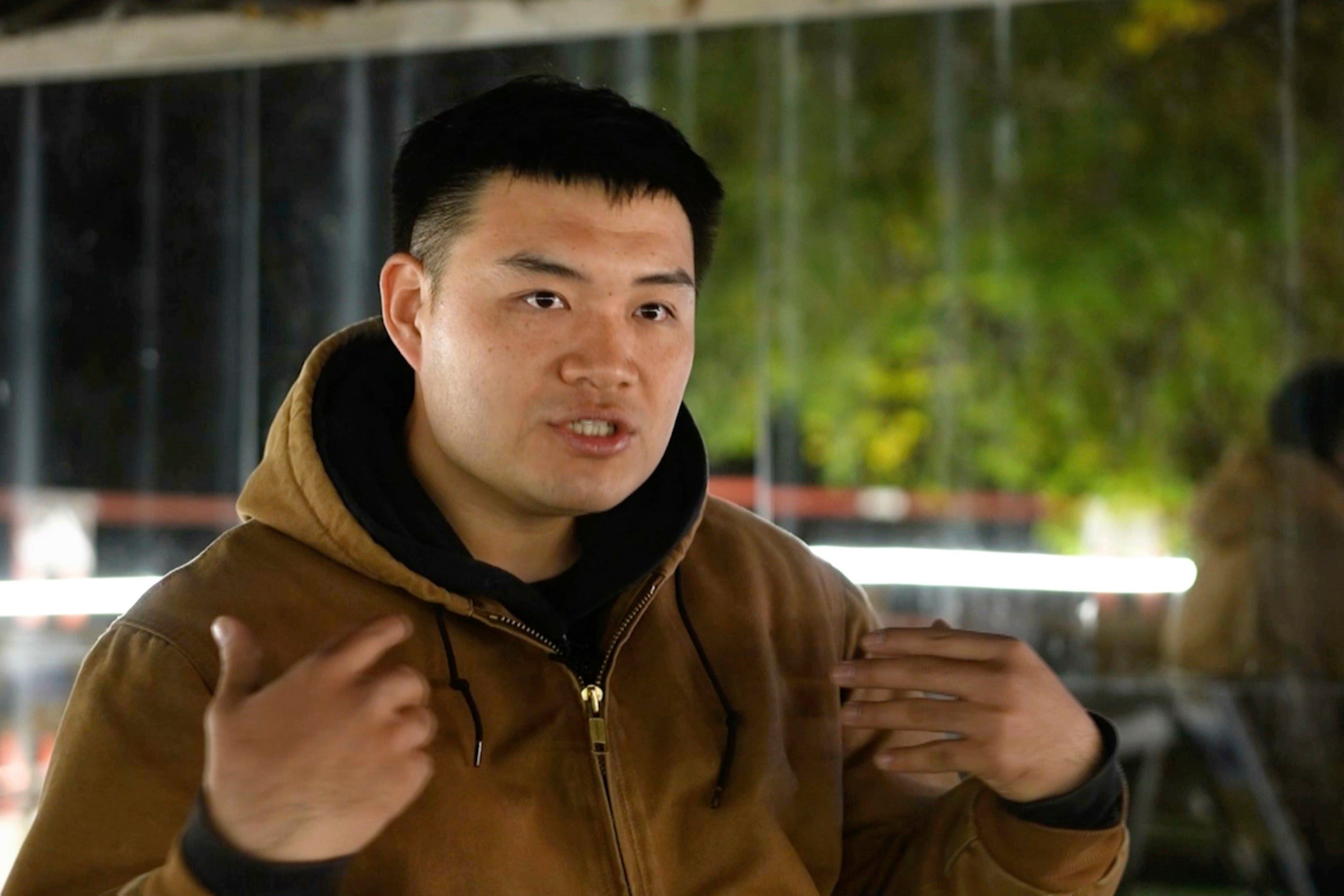 Xing Long, a DJ and rave organizer, speaks during an interview with The Associated Press in his hometown of Changchun