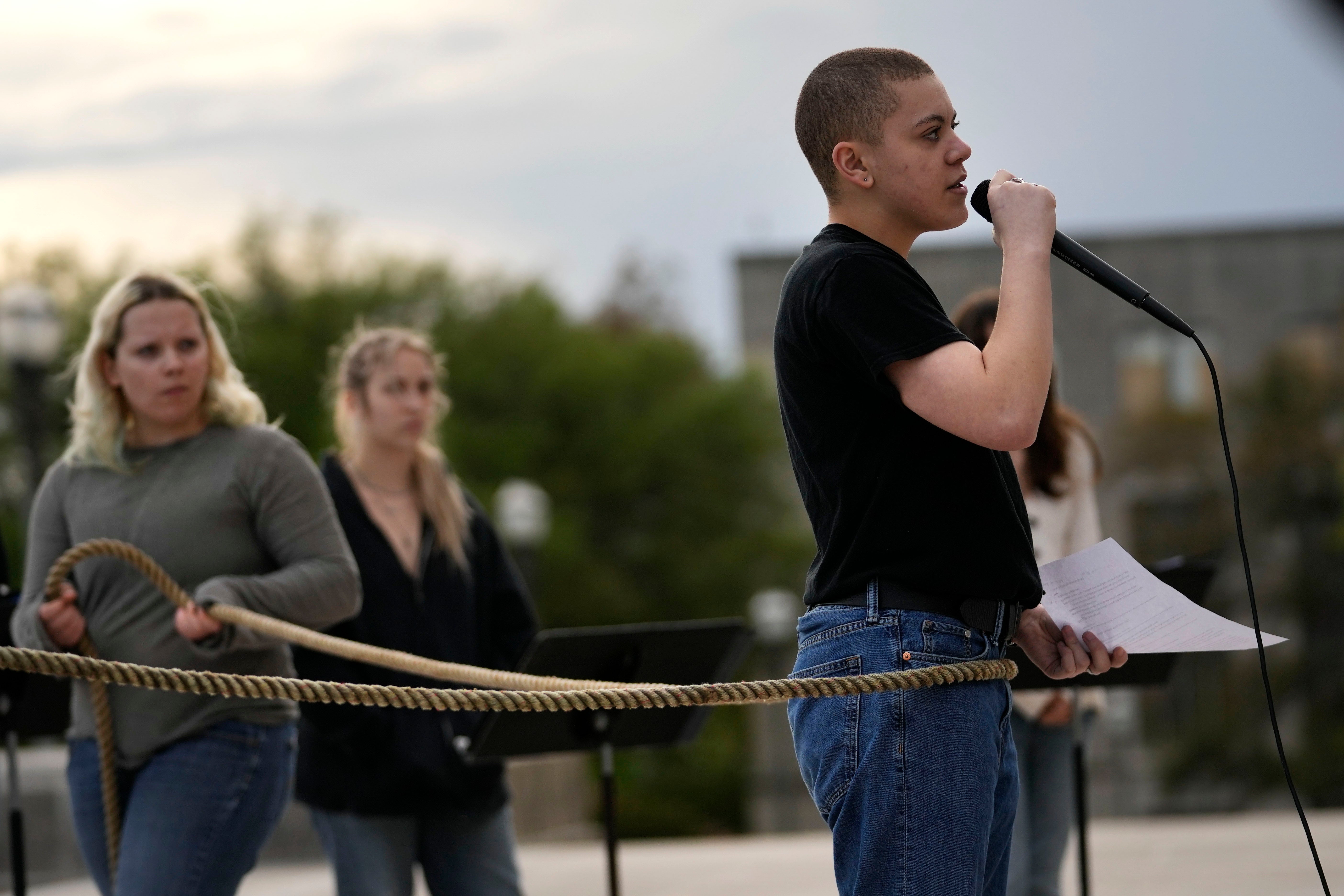 Jude Armstrong and fellow Benjamin Franklin High playwriting class students perform their play, "The Capitol Project," on the steps of the Louisiana Capitol in Baton Rouge, La., March 27, 2024.