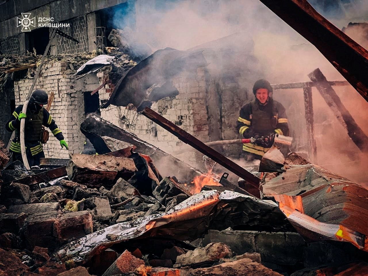 Firefighters in an industrial area of Kyiv, which was hit by a Russian missile strike on 13 November, 2024