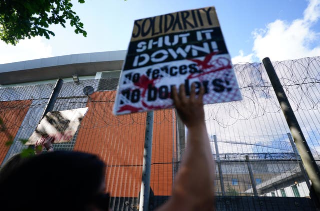 <p>Migrants rights groups hold a show of support for people detained at Brook House Immigration Removal Centre at Gatwick who are scheduled to be sent to Rwanda. </p>