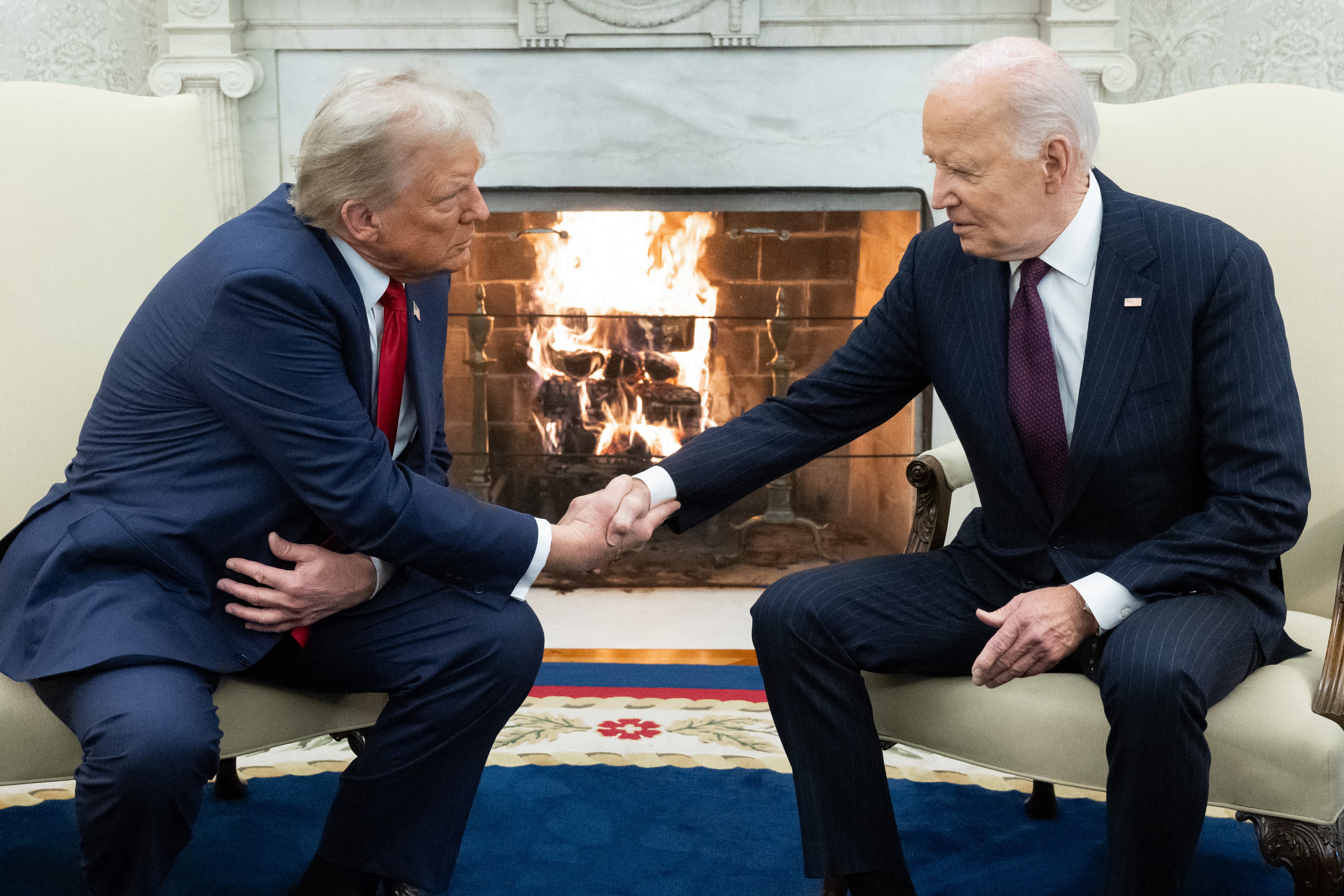 Donald Trump shakes hands with Joe Biden inside the White House on November 13, resuming a tradition that Trump skipped four years ago