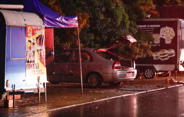 <p>A destroyed car is seen where a second explosion took place near Brazil’s Supreme Court</p>