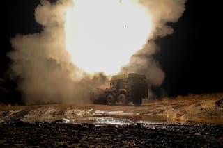 In this photo taken from a video released by Russian Defense Ministry press service on Thursday, Nov. 14, 2024, Russian Zemledeliye remote minelaying system fires towards Ukrainian positions at an undisclosed location in Ukraine.