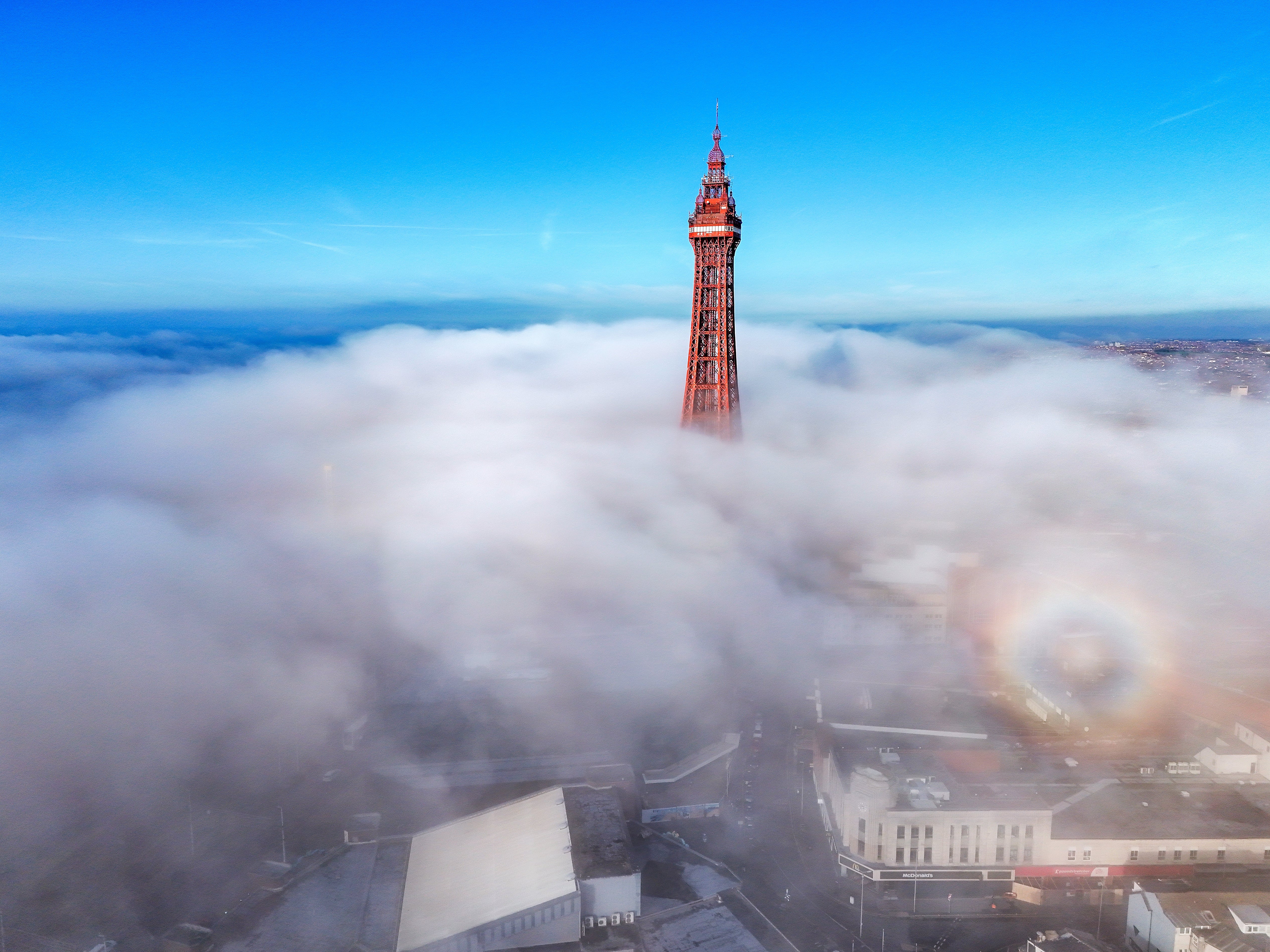 An aerial view of Blackpool Tower surrounded by fog