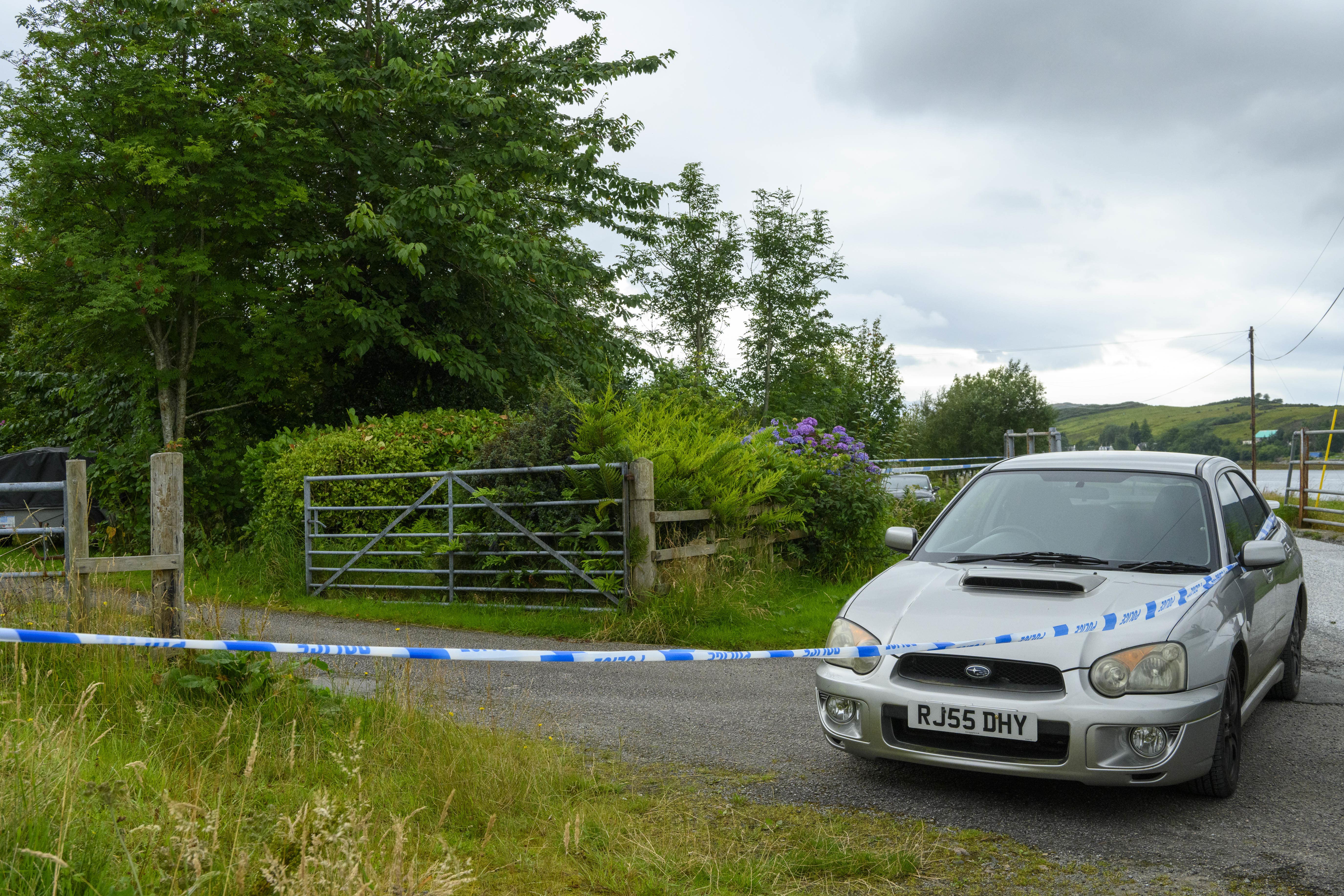 Police tape at the scene of an incident at a property in the Dornie area of Wester Ross in August 2022 (PA)