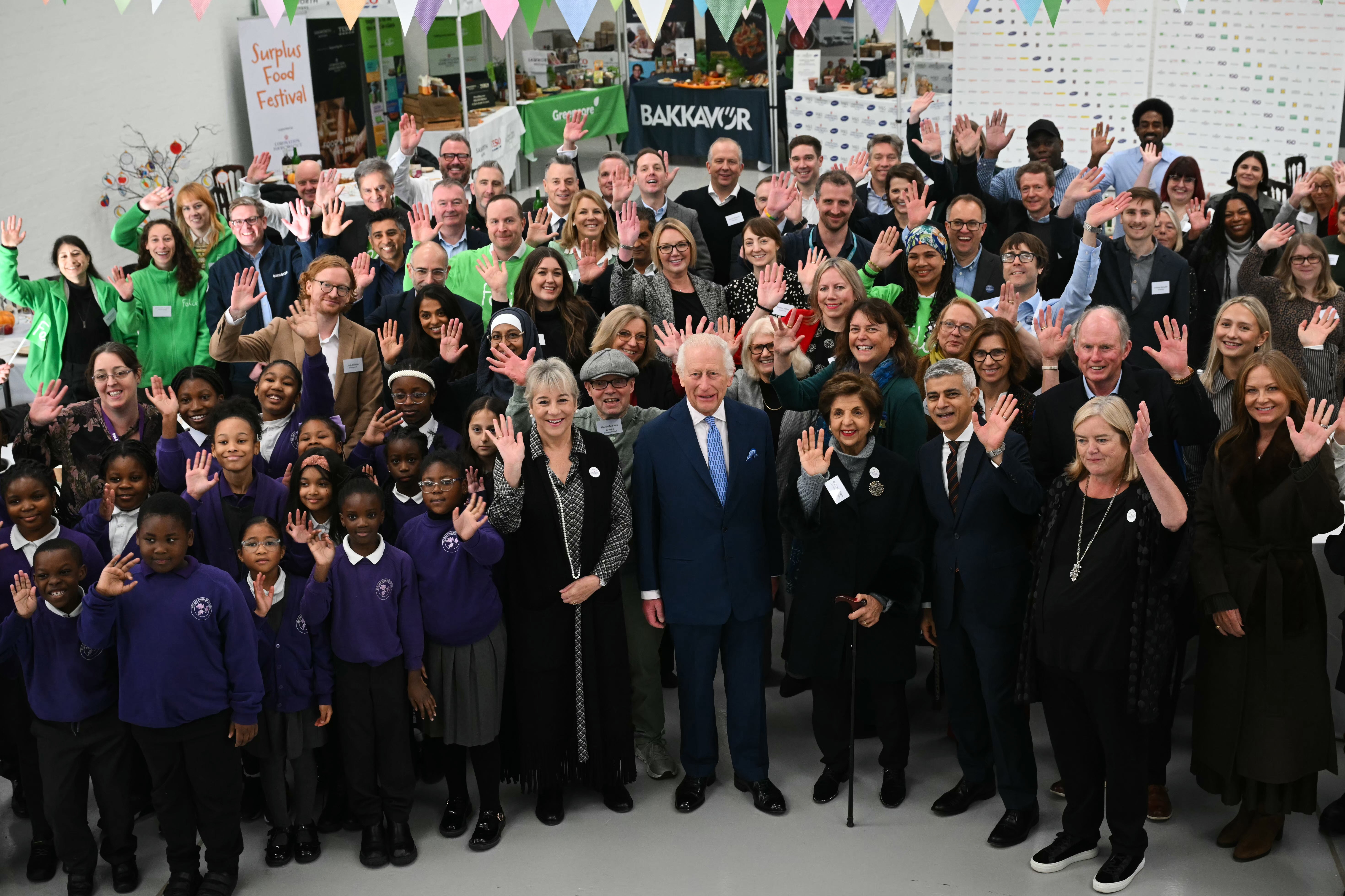 The King poses for a photo as he visits the first Coronation Food Hub in Deptford