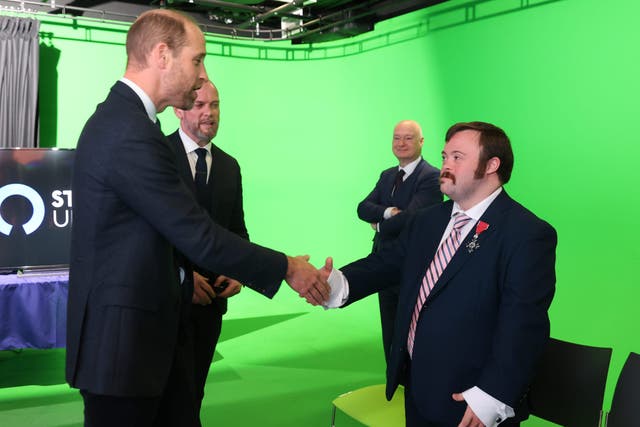 The Prince of Wales meets Belfast-born actor, James Martin during a visit to Ulster University (Liam McBurney/PA)