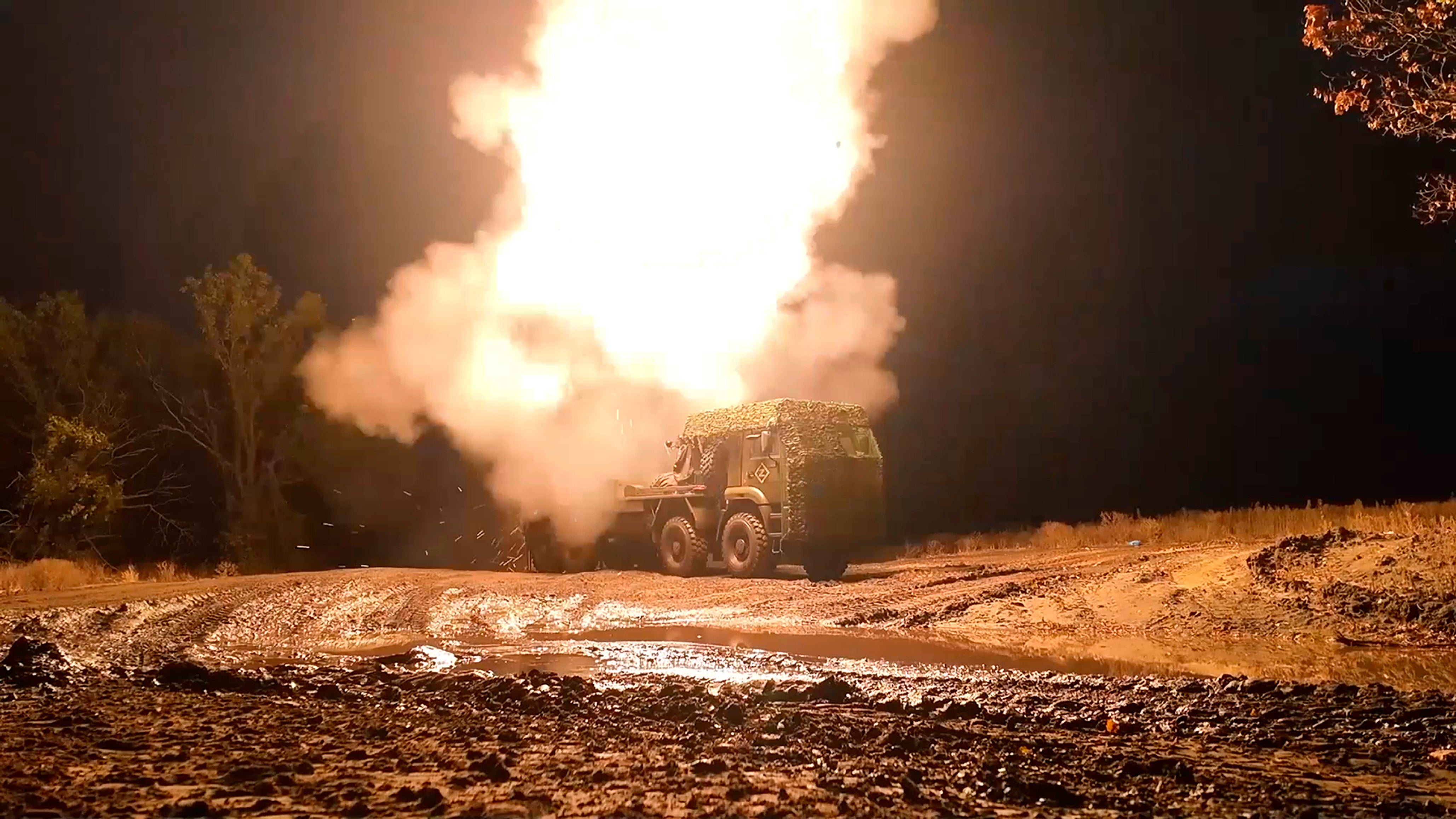 A Russian multiple launch rocket system (MLRS) “Zemledeliye” fires towards Ukrainian positions at an undisclosed location in Ukraine